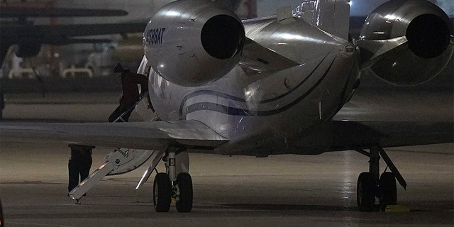 WNBA star Brittney Griner deplanes at Kelly Field in San Antonio following her release in a prisoner swap with Russia, Friday, Dec. 9, 2022.