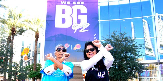 Perci Ami, left, of Laveen, Ariz., and Patty Talahongva show support for Brittney Griner, Thursday, Dec. 8, 2022, in Phoenix. Griner was released from a Russian prison in a prisoner swap earlier in the day.