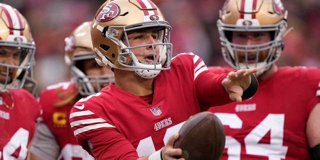 Brock Purdy of the San Francisco 49ers celebrates after scoring a touchdown against the Tampa Bay Buccaneers, Dec. 11, 2022, in Santa Clara, California.