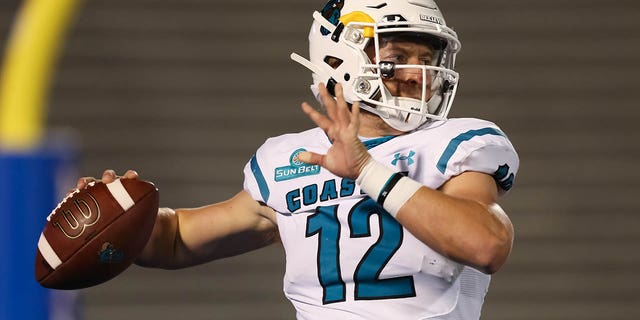 Coastal Carolina Chanticleers quarterback Bryce Carpenter throws a pass in warmups before a college football game between the Coastal Carolina Chanticleers and Kansas Jayhawks on September 12, 2020, at Memorial Stadium in Lawrence, KS.