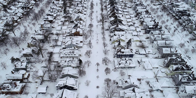 Fordham Avenue, center, and the 1901 Pan-American Exposition neighborhood of Buffalo, New York, is coated in a blanket of snow after the blizzard, Tuesday, Dec. 27, 2022. 