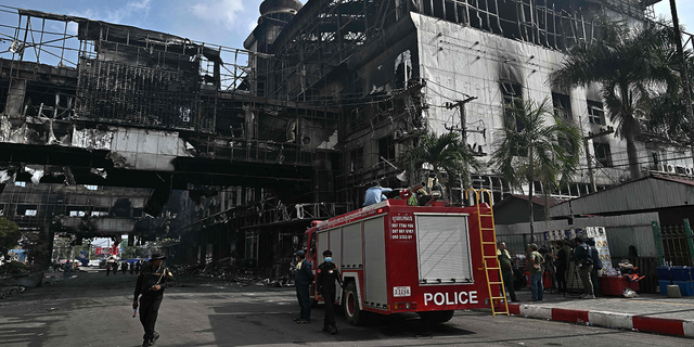 First responders from nearby Thailand are among those working the scene of the fire Thursday.