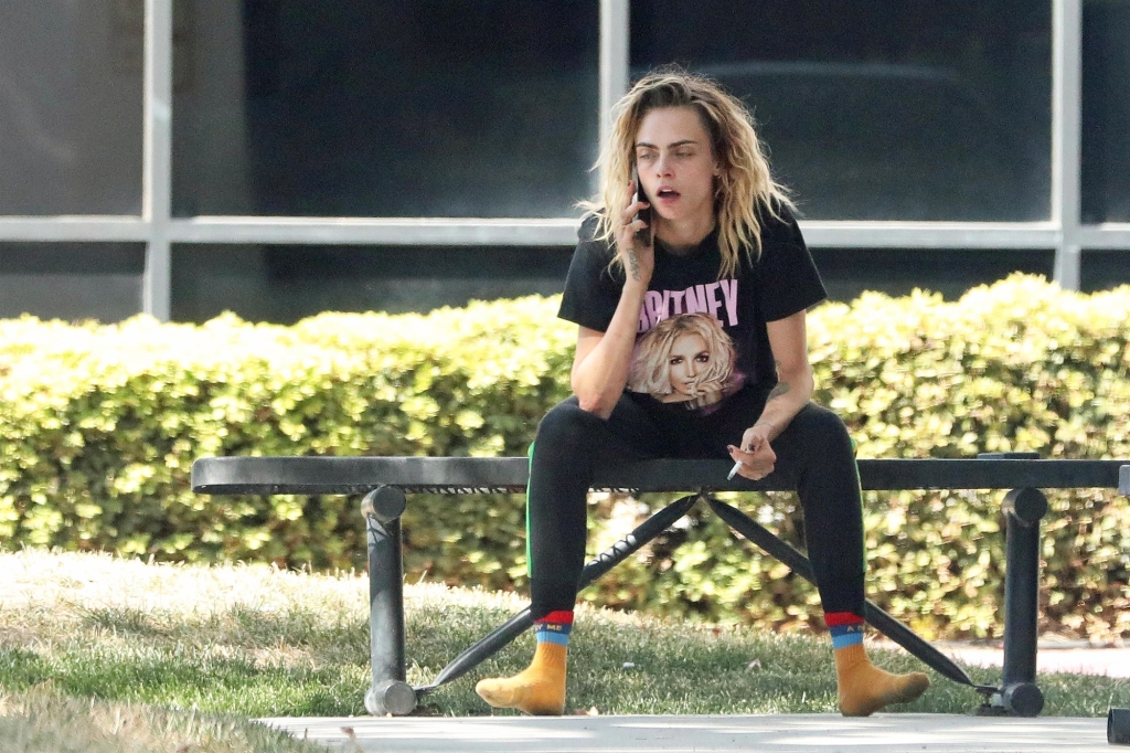 A very tired and tattered-looking Cara Delevingne is seen going to the puma private jet owned by JAY-Z. The model-actress is looking worse for wear as she was spotted at Van Nuys airport wearing no shoes and looking as if she has been having a little bit too much fun. The cover girl was seen with her dog Alfie and her assistant getting onto the puma private jet before shortly being not allowed to fly.
