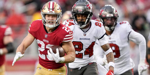 San Francisco 49ers running back Christian McCaffrey runs for a touchdown against the Tampa Bay Buccaneers in Santa Clara, California, Sunday, Dec. 11, 2022.