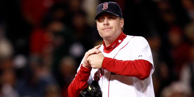 Boston Red Sox pitcher Curt Schilling stands behind the mound after giving up an RBI double to Cleveland Indians' Victor Martinez during the first inning in Game 2 of MLB's ALCS playoff series in Boston Oct. 13, 2007.