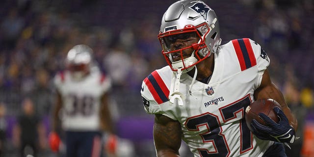 New England Patriots running back Damien Harris (37) runs with the ball during warmups before a game between the Minnesota Vikings and New England Patriots on November 24, 2022, at U.S. Bank Stadium in Minneapolis, MN.