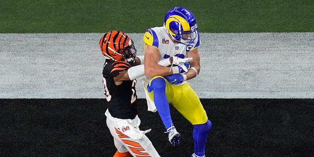 Los Angeles Rams wide receiver Cooper Kupp grabs a touchdown pass as Cincinnati Bengals cornerback Eli Apple defends during the second half of Super Bowl LVI at SoFi Stadium in Inglewood, California, on Feb. 13, 2022.