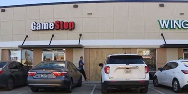 Boarded up GameStop location in Orlando, Fla.