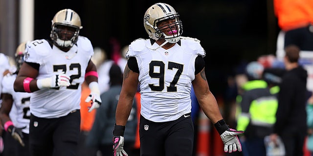 Defensive end Glenn Foster, #97 of the New Orleans Saints, takes the field before the start of the Saints and New England Patriots game at Gillette Stadium on Oct. 13, 2013 in Foxboro, Massachusetts.