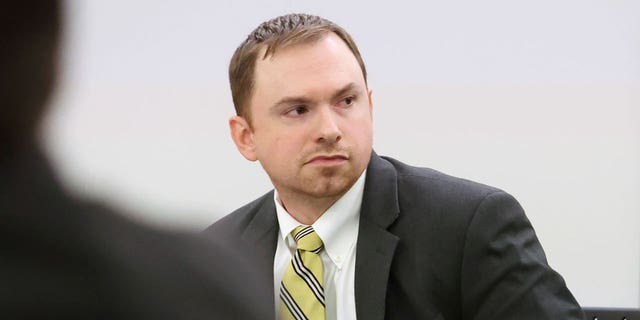 Aaron Dean looks towards the gallery before the continuation of the punishment phase of his trial on Dec. 19, 2022, at Tarrant County's 396th District Court at the Tim Curry Criminal Justice Center in Fort Worth, Texas.