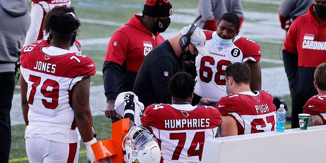 Arizona Cardinals offensive line coach Sean Kugler talks to his players during a game against the New England Patriots Nov. 29, 2020, at Gillette Stadium in Foxborough, Mass. 