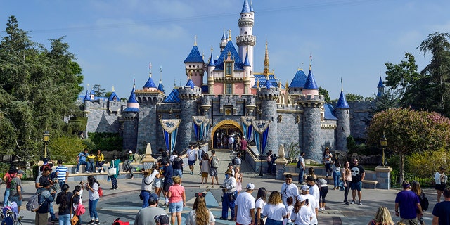 Visitors to Disneyland in front of Sleeping Beauty Castle inside Disneyland in Anaheim, CA, on Friday, September 3, 2021. 