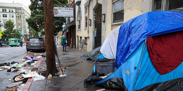 Homeless people are seen on streets of the Tenderloin district in San Francisco.