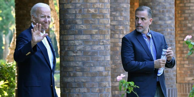 President Joe Biden waves alongside his son, Hunter Biden, after attending Mass at Holy Spirit Catholic Church on Johns Island, South Carolina, on Aug. 13, 2022.