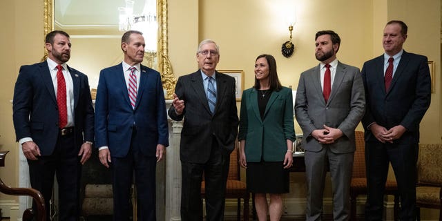 From left to right, Sen.-elect Markwayne Mullin (R-OK), Sen.-elect Ted Budd (R-NC), Senate Minority Leader Mitch McConnell (R-KY), Sen.-elect Katie Britt (R-AL), Sen.-elect JD Vance (R-OH) and Sen.-elect Eric Schmitt (R-MO) stand for a photo opportunity in McConnell's office at the U.S. Capitol on Nov. 15, 2022 in Washington, D.C.