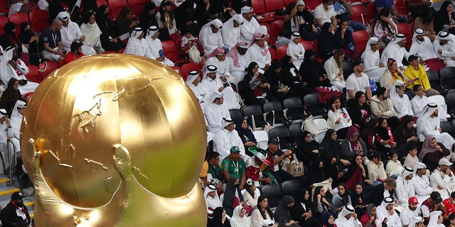 A replica of the FIFA World Cup trophy is seen during the match between Qatar and Ecuador at Al Bayt Stadium on Nov. 20, 2022, in Al Khor, Qatar.