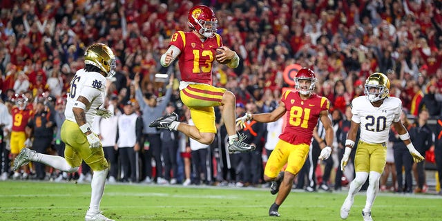 USC quarterback Caleb Williams (13) runs the ball for a touchdown against Notre Dame, Nov. 26, 2022, at Los Angeles Memorial Coliseum in Los Angeles.