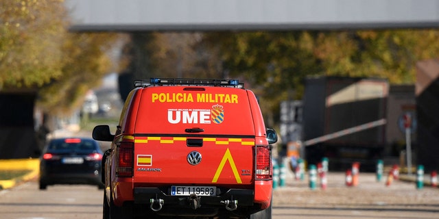 A military police car patrols at the main entrance of the Spanish air force base, in Torrejon de Ardoz near Madrid, on December 1, 2022, after Spain's security forces found a "suspect" package, a day after a letter bomb exploded at Ukraine's embassy in the Spanish capital. 