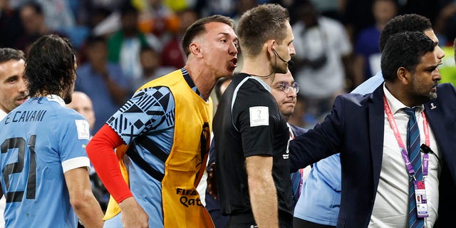 Uruguay's goalkeeper #01 Fernando Muslera remonstrates with German referee Daniel Siebert at the end of the Qatar 2022 World Cup Group H football match between Ghana and Uruguay at the Al-Janoub Stadium in Al-Wakrah, south of Doha on December 2, 2022. 