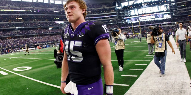 Max Duggan of TCU walks off the field following the team's 31-28 overtime loss to Kansas State in the Big 12 Football Championship on Dec. 3, 2022, in Arlington, Texas.