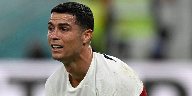 Portugal's forward #7 Cristiano Ronaldo reacts after his team lost the Qatar 2022 World Cup quarter-final football match between Morocco and Portugal at the Al-Thumama Stadium in Doha on December 10, 2022. 