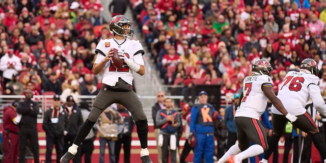 Tom Brady (12) of the Tampa Bay Buccaneers drops back to pass against the San Francisco 49ers during the first half at Levi's Stadium Dec. 11, 2022, in Santa Clara, Calif. 