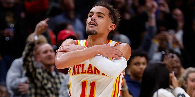 Trae Young of the Hawks reacts after a three pointer during overtime against the Chicago Bulls at State Farm Arena on Dec. 11, 2022 in Atlanta, Georgia.