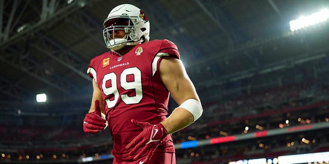 J.J. Watt of the Arizona Cardinals warms up before kickoff against the New England Patriots at State Farm Stadium on Dec. 12, 2022, in Glendale, Arizona.