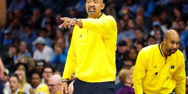 Michigan Wolverines head Coach Juwan Howard shouts instructions to his players during the Jumpman Invitational against the North Carolina Tar Heels on Dec. 21, 2022 at Spectrum Center in Charlotte, North Carolina.