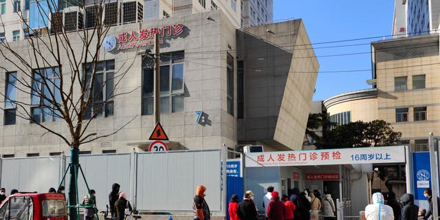 SHANGHAI, CHINA - DECEMBER 24, 2022 - Patients line up outside a fever clinic at a hospital in Shanghai, China, December 24, 2022. 