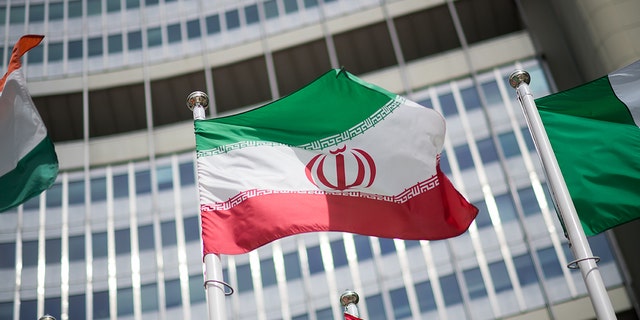 The flag of Iran is seen in front of the building of the International Atomic Energy Agency (IAEA) Headquarters ahead of a press conference by Rafael Grossi, Director General of the IAEA, about the agency's monitoring of Iran's nuclear energy program on May 24, 2021 in Vienna. The IAEA has been in talks with Iran over extending the agency's monitoring program. Meanwhile, Iranian and international representatives have been in talks in recent weeks in Vienna over reviving the Joint Comprehensive Plan of Action Iran nuclear deal.