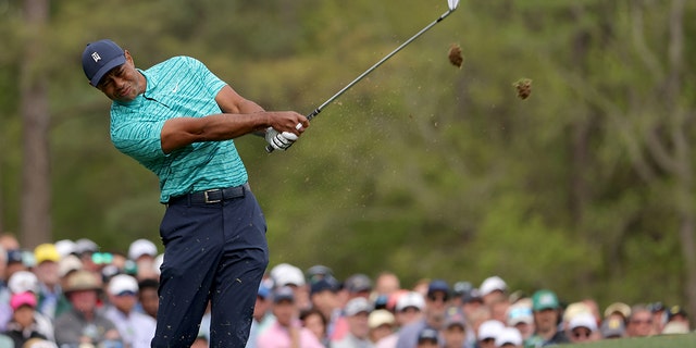 Tiger Woods plays his shot from the 12th tee during the second round of The Masters at Augusta National Golf Club in Augusta, Georgia, on April 8, 2022.