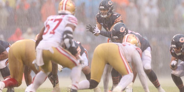 Justin Fields, #1 of the Chicago Bears, prepares to snap the ball against the San Francisco 49ers during the fourth quarter at Soldier Field on Sept. 11, 2022 in Chicago.