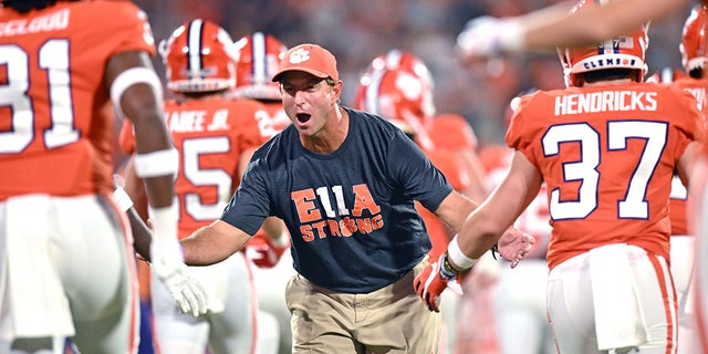 Head coach Dabo Swinney of the Clemson Tigers greets his players as they take the field before a game against the Louisiana Tech Bulldogs at Memorial Stadium Sept. 17, 2022, in Clemson, S.C. 