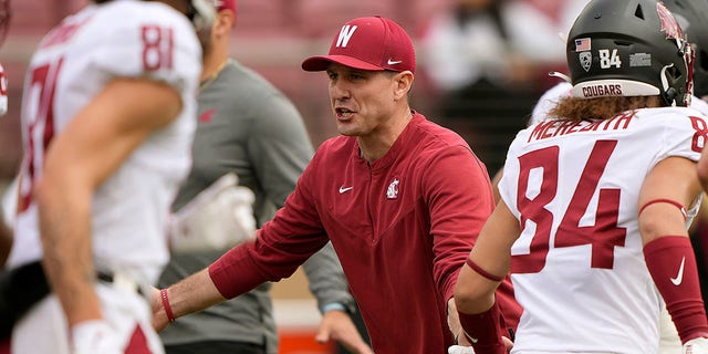 Head coach Jake Dickert of the Washington State Cougars looks on while his team warms up prior to playing the Stanford Cardinal at Stanford Stadium Nov. 5, 2022 in Stanford, Calif. 