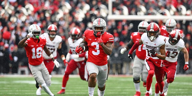 Miyan Williams (3) of the Ohio State Buckeyes runs with the ball during the second quarter of a game against the Indiana Hoosiers at Ohio Stadium Nov. 12, 2022, in Columbus, Ohio. 