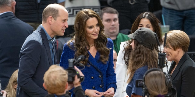 The Prince and Princess of Wales spoke with 15-year-old climate change activist Ollie Perrault courtside at the Celtics game, after she was honored by the "Heroes Among Us" program.