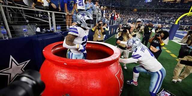 Ezekiel Elliott and Dak Prescott of the Dallas Cowboys in the fourth quarter against the Indianapolis Colts on Dec, 04, 2022.