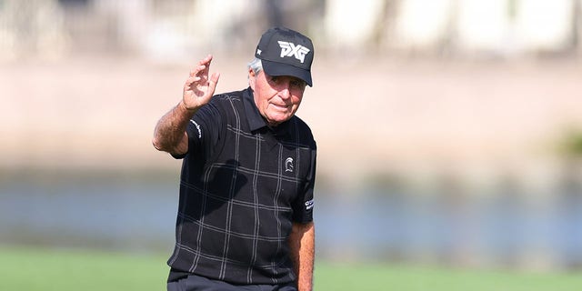 Gary Player, of South Africa, waves to the crowd on the 18th hole during the pro-am prior to the PNC Championship at Ritz-Carlton Golf Club on Dec. 16, 2022 in Orlando, Florida. 