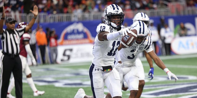 JSU receiver Travis Hunter celebrates with teammates after scoring during the Jackson State Tigers and North Carolina Central Eagles Celebration Bowl Football Championship game at Mercedes-Benz Stadium on Dec. 17, 2022, in Atlanta, GA 