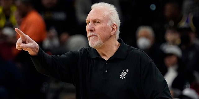 San Antonio Spurs head coach Gregg Popovich signals to his players during the first half of an NBA basketball game against the Los Angeles Lakers, Monday, March 7, 2022, in San Antonio.