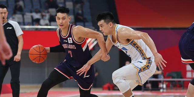 Jeremy Lin (7) of the Guangzhou Loong Lions drives the ball during a Chinese Basketball Association match against the Beijing Ducks Oct. 22, 2022, in Hangzhou, Zhejiang Province of China.