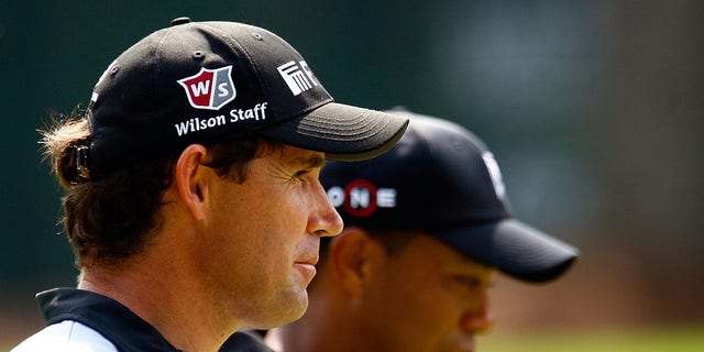 Padraig Harrington walks alongside Tiger Woods on the 16th hole during the third round of THE TOUR Championship presented by Coca-Cola, the final event of the PGA TOUR Playoffs for the FedEx Cup, at East Lake Golf Club in Atlanta on Sept. 26, 2009. 