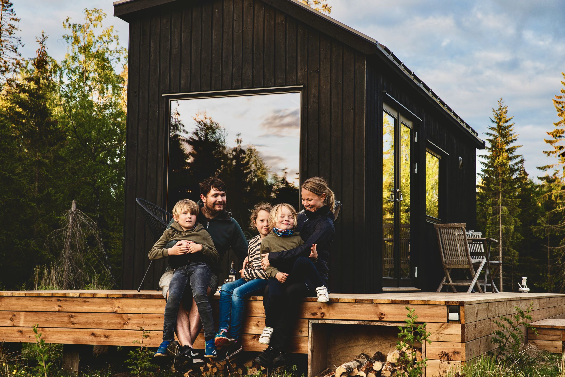 Jesper and Petra in front of one of the InForest cabins named after their three children.