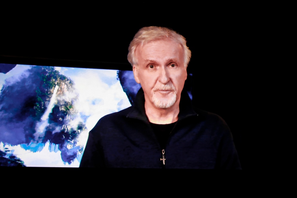 James Cameron with a photo of the earth. 