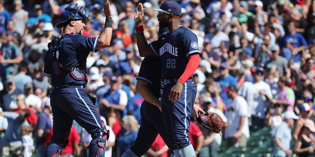 Yan Gomes and Jason Heyward of the Cubs celebrate after they defeated the Atlanta Braves 1-0 at Wrigley Field on June 17, 2022, in Chicago.