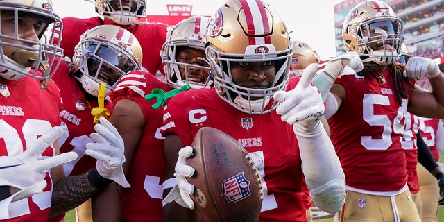 San Francisco 49ers cornerback Jimmie Ward, #1, celebrates his interception with teammates in the second half of an NFL football game against the Washington Commanders, Saturday, Dec. 24, 2022, in Santa Clara, California.