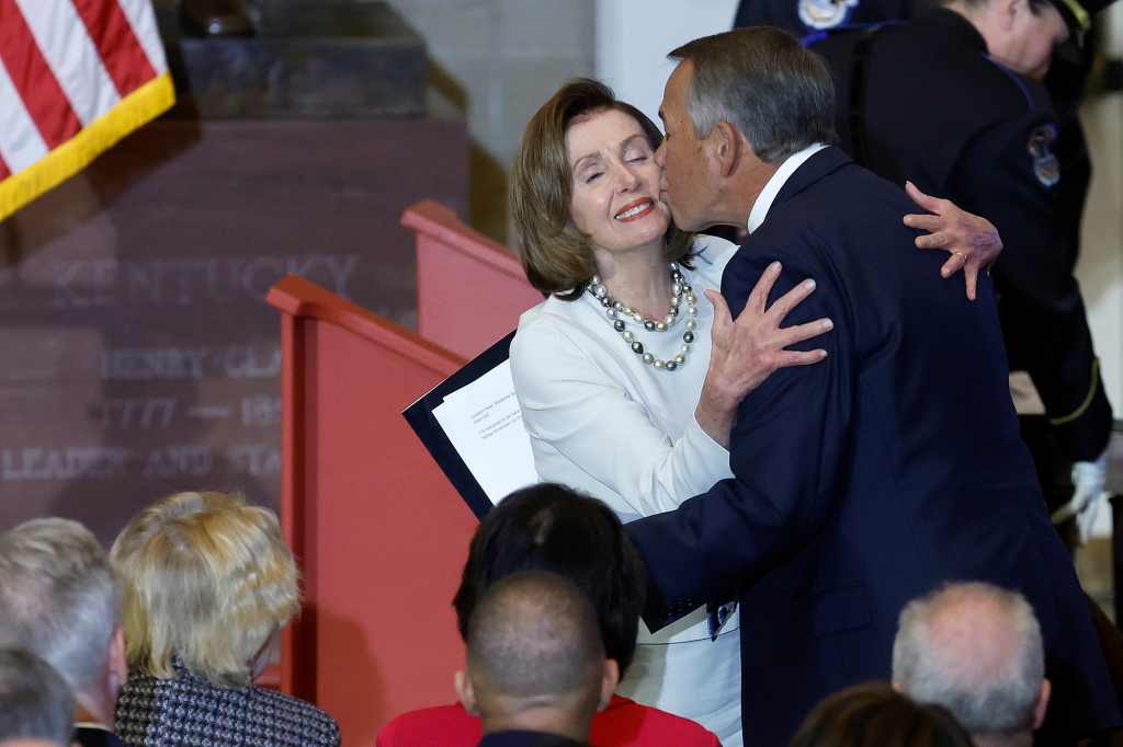 John Boehner embraces House Speaker Nancy Pelosi at the unveiling of her official portrait at the US Capitol on Wednesday. 