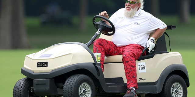 John Daly drives his cart to the 17th hole during the second round of the PGA Championship at Southern Hills Country Club on May 20, 2022, in Tulsa, Oklahoma.