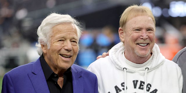 Owner Robert Kraft of the New England Patriots, left, and owner and managing general partner Mark Davis of the Las Vegas Raiders pose for photos before their teams' game at Allegiant Stadium Dec. 18, 2022, in Las Vegas. The Raiders defeated the Patriots 30-24.